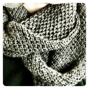close up of knitted gray honey cowl scarf