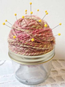 step 5 of creating a pin cushion from yarn