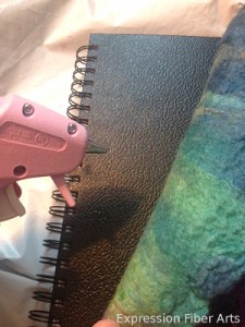 hot glueing a felted journal cover